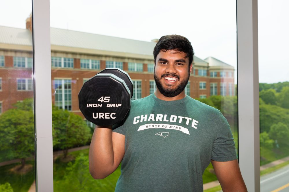 John Gopali lifting weights at the UNC Charlotte University Recreation Center
