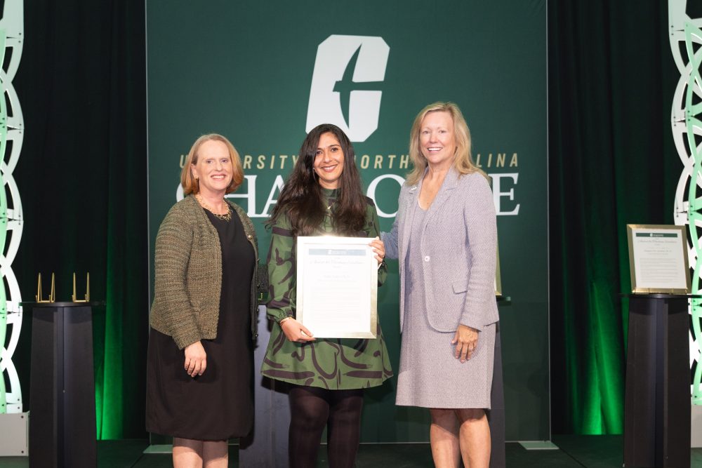 Najjar (center) recognized in award ceremony by UNC Charlotte Chancellor Sharon L. Gaber (left) and Provost Jennifer Troyer (right)