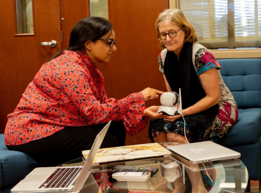 Meera Sridhar in the IoT lab with former UNC Charlotte faculty and professor emerita Mary Lou Maher